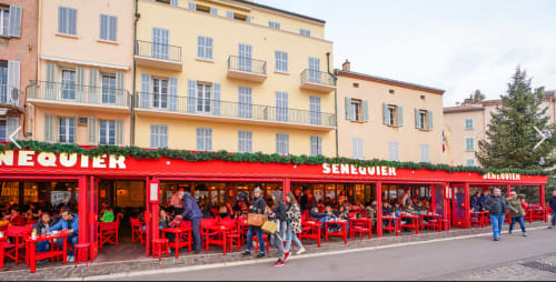 Senequier café with red chairs and tables in La Croix Valmer, near Villa Sigahi accommodation