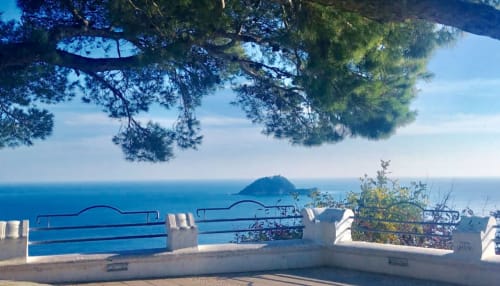 Scenic Mediterranean view from Santa Croce terrace in Alassio, Italy with blue sea and coastal island