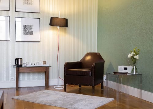 Chambre Agastache at Clos des Moulins: reading corner with leather armchair, floor lamp, and desk in Poitiers B&B