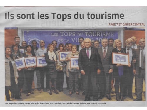 Tourism award winners holding certificates at Poitiers ceremony, promoting regional hospitality excellence
