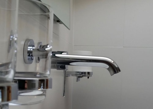 Modern chrome bathroom faucet and fixtures at Clos des Moulins bed and breakfast in Poitiers