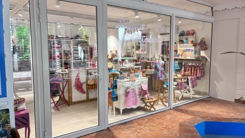 Colorful children's clothing boutique storefront at Caribluewave Apartements in St-François, Guadeloupe