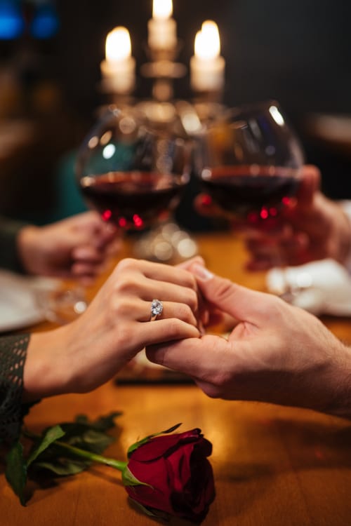 Engagement ring displayed at romantic dinner with wine at Belloréade B&B in Belloc
