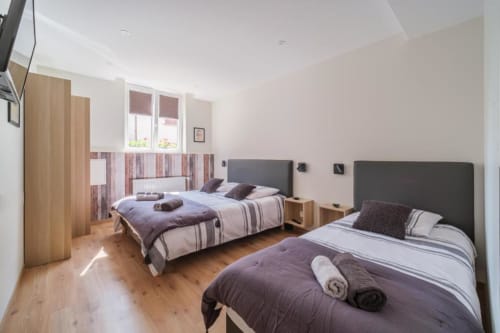 Chambre cosy du gîte Le Caveau de Sigo à Kaysersberg Vignoble, décor alsacien authentique
