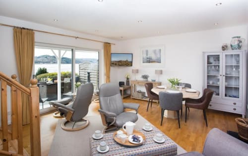 Spacious lounge and dining area with sea view Inverness