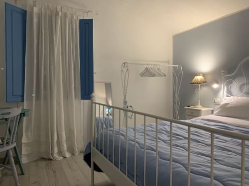 Camera Celestiale all'Agriturismo Il Pomo d'oro ad Assemini: letti gemelli, vista sul giardino e comfort moderni