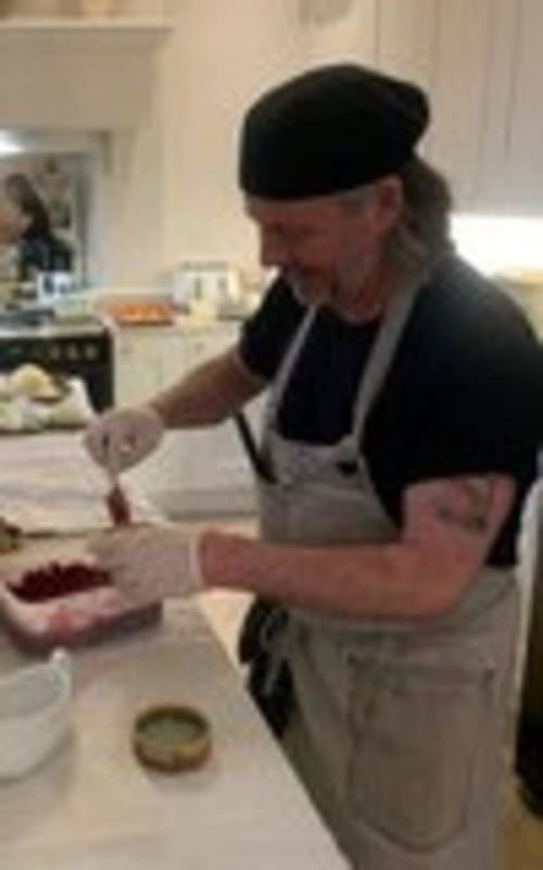 Chef preparing food in kitchen at Three Little Pigs hotel, Blandford Forum
