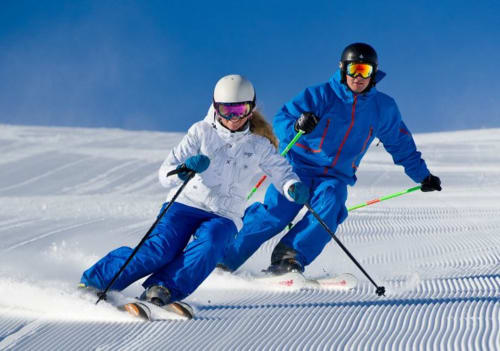 Two skiers enjoy pristine slopes near Stella CasaBono hotel in Sulmona, Abruzzo, Italy