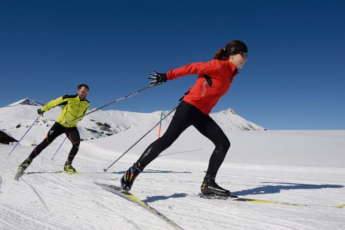 Two cross-country skiers on snowy mountain slopes near Sulmona, Italy at Stella CasaBono hotel