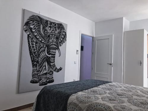 Modern bedroom with ornate elephant wall art at Complejo Turístico Retiro del Teatro, Almagro