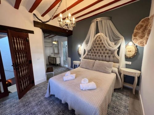 Romantic Suite 8 with canopied bed, Jacuzzi, and elegant décor at Complejo Turístico Retiro del Teatro, Almagro