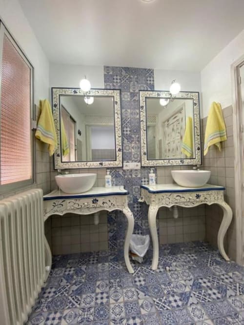 Elegant double vanity bathroom in Corral de Comedias Studio at Retiro del Teatro with ornate mirrors, blue patterned tiles,