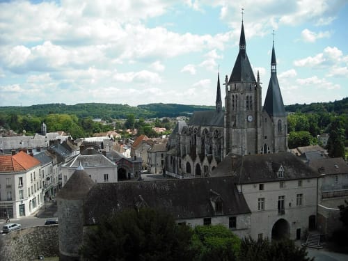 Medieval church with twin spires overlooking French village near Boissy-le-Sec, Essonne