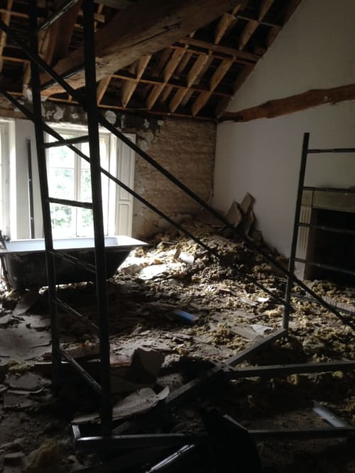 Renovation in progress at Domaine de l'Ocrerie showing interior demolition and structural work in Pourrain
