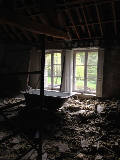 Abandoned bathroom with debris at Domaine de l'Ocrerie B&B, Pourrain France renovation project
