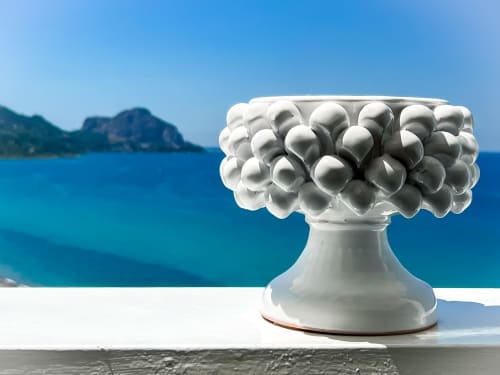 White decorative vessel overlooking turquoise Aegean Sea at CefalHome, romantic Mediterranean coastal retreat