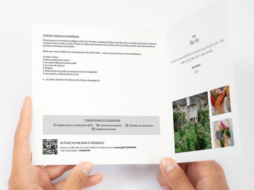 Clos des Moulins gift card held in hands, Poitiers B&B with riverfront garden, activities and local artisan experiences
