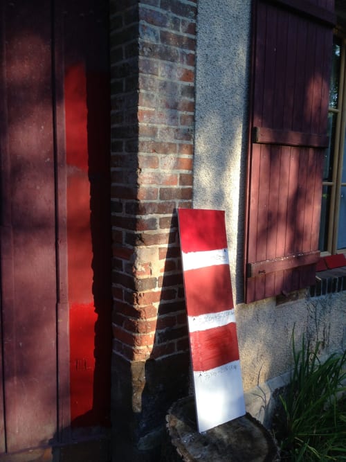 Red and white striped marker post at Domaine de l'Ocrerie B&B entrance in Pourrain, France