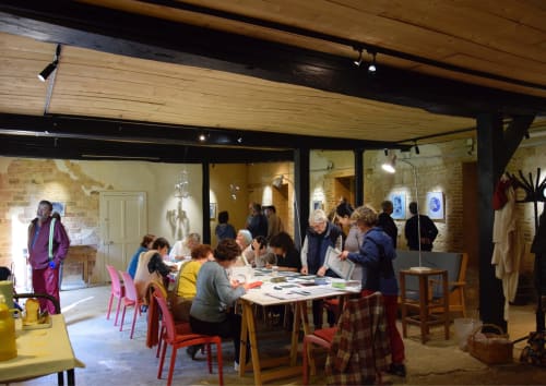 Community gathering at Domaine de l'Ocrerie in Pourrain with guests at shared table