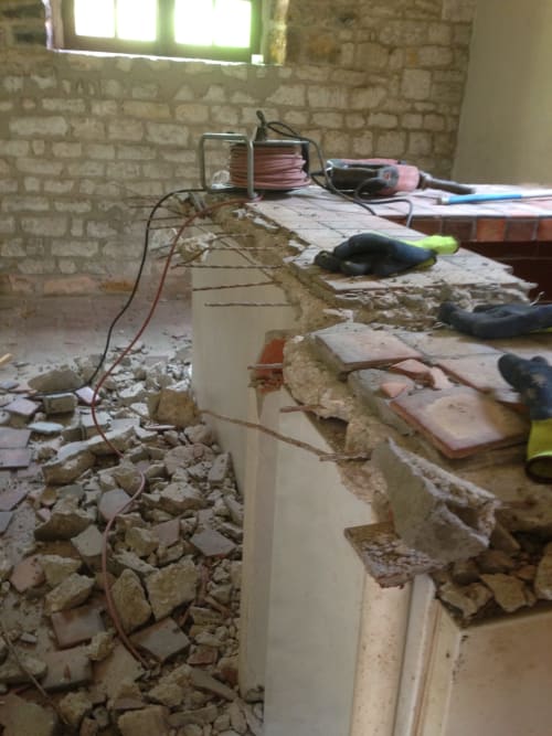 Construction debris and tools in renovated room at Domaine de l'Ocrerie, Pourrain