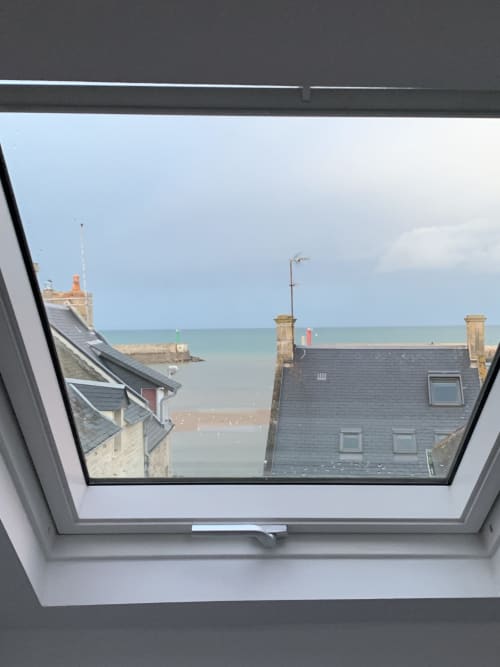 Skylight view of sea and harbor from Simone sur Mer room, Port-en-Bessin-Huppain