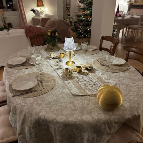 Elegantly set dining table at Château Ségot B&B in Neuilly-le-Réal with Christmas décor