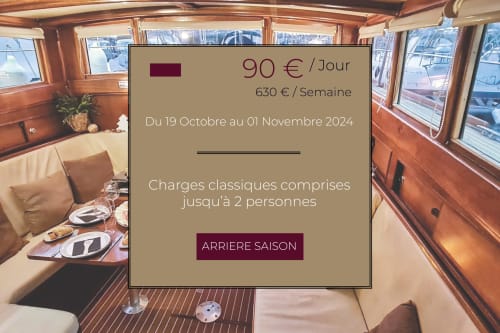 Intérieur luxueux de cabine yacht à Banyuls-sur-Mer avec salle à manger, tarif 90€/jour du 19 oct.-1er nov. 2024