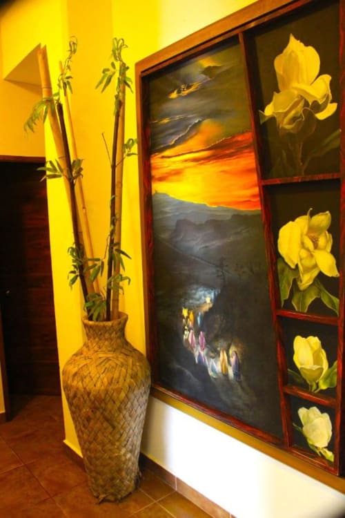 Bright yellow room at Isla Tajín Beach Resort with yellow iris paintings, woven vase with bamboo stems, and sunset landscape