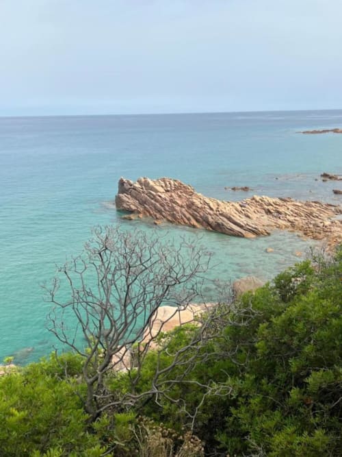 Turquoise coastal waters with rocky outcrops and Mediterranean vegetation near Agriturismo Su Barraccu, Loceri