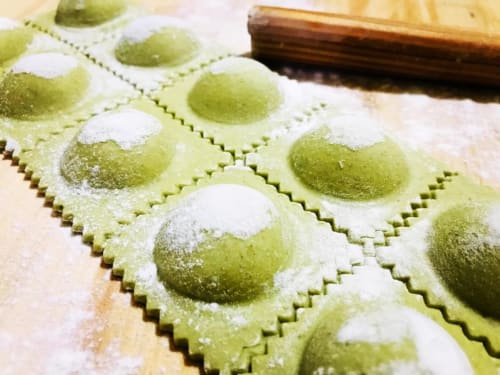 Fresh green ravioli dusted with flour at Agriturismo Su Barraccu in Loceri, Italy