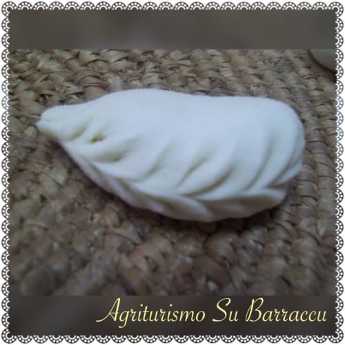 White decorative soap on textured fabric at Agriturismo Su Barraccu in Loceri