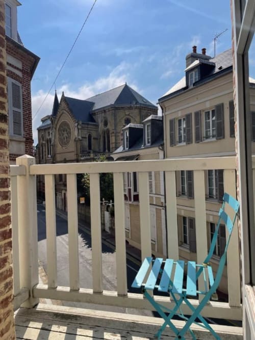 Hotel Le Trouville balcony overlooking courtyard with historic church, Trouville-sur-Mer