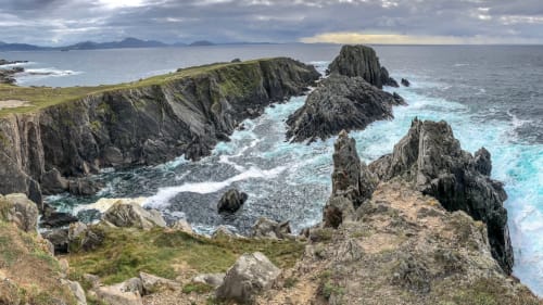 Dramatic rocky coastline with turquoise waters near Duffy Lodge, County Donegal, Ireland