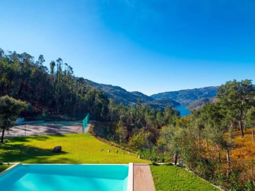 Casa da Luz Gerês luxury pool overlooking forested mountains and lake in Vieira do Minho