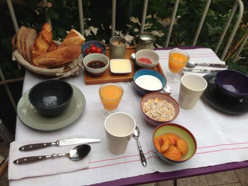 Breakfast on the balcony at Ancienne Maison Des Gardes