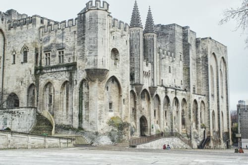 Medieval stone castle exterior with Gothic arches, Domaine des Lavarines in Morières-lès-Avignon