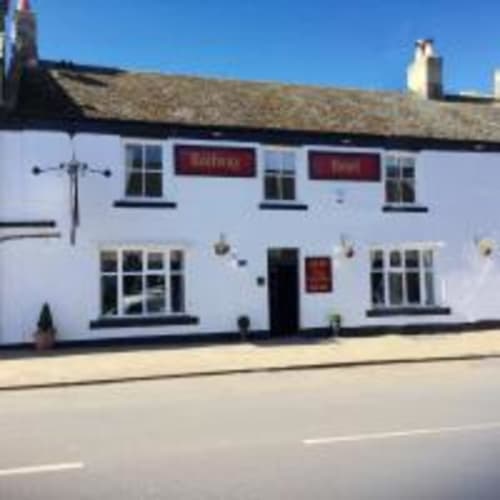 The Railway Hotel, a white-painted building with dark windows in Haydon Bridge, Hexham