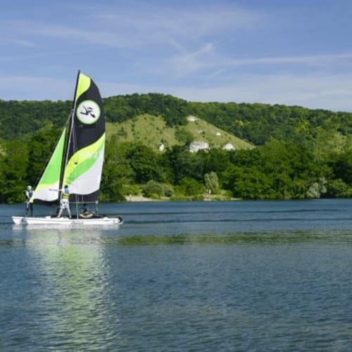 Sailboat with lime green and black sail on the Seine near Clairseine B&B in Tournedos-sur-Seine, France