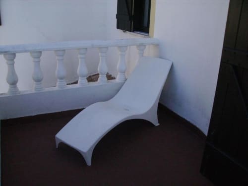 White curved bench seating on terrace with balustrade railing at Ocean View Lagos hostel, Lagos Portugal
