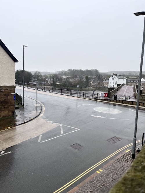 Wet parking area at The Railway Hotel Haydon Bridge with countryside views, Hexham, England