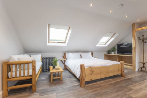 Stable Lodge B&B in Cheltenham | Family Suite Seating area and Super king oak bed