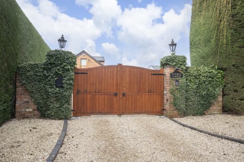 Solid Electric Gates With Intercom For Secure Parking | Stable Lodge Boutique B&B in Cheltenham