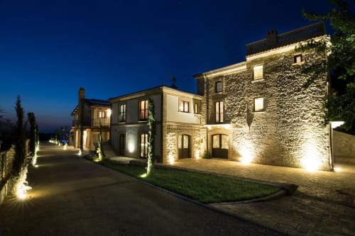 Casale 905 luxury B&B in Crecchio, Italy illuminated at night with stone architecture