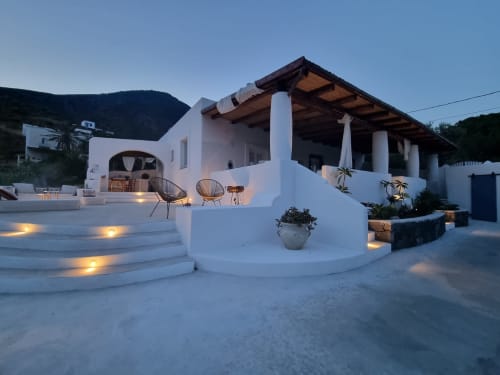 Miravilla Salina B&B in Santa Marina Salina features white Mediterranean architecture with terrace, wooden pergola, and