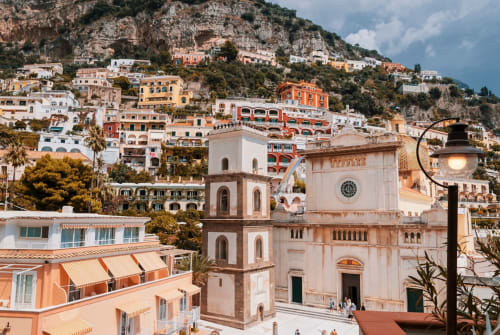 Casa Castagna B&B in Salerno overlooks colorful cliffside buildings and historic cathedral tower