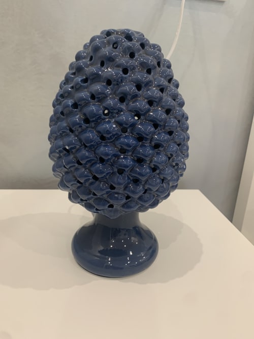 Blue ceramic pinecone decoration in Maryam 23 guestroom, Siracusa