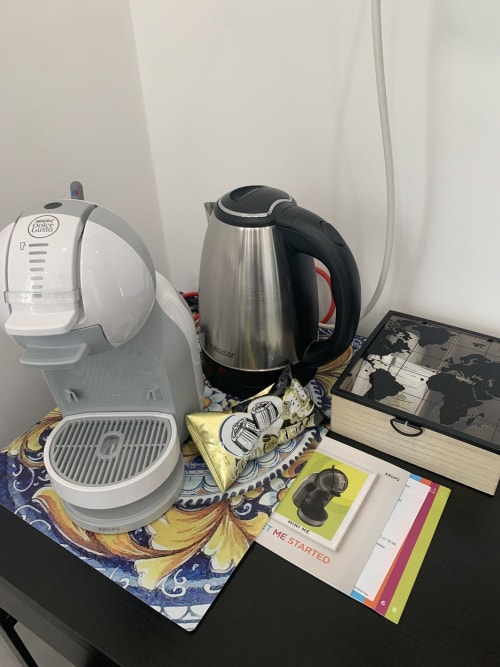 Coffee maker and kettle on decorative tray in Maryam 23 B&B Syracuse