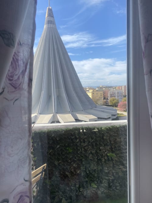 Balcony view of modern tent-like structure with Siracusa cityscape at Maryam 23 B&B