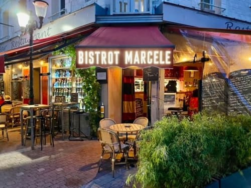 Bistrot Marcele restaurant exterior at Hotel Le Trouville in Trouville sur Mer with outdoor seating and evening lighting