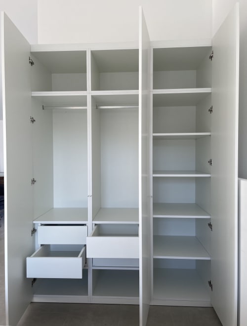 Empty white built-in wardrobe with shelves and drawers at Star Host, Bordeira Portugal